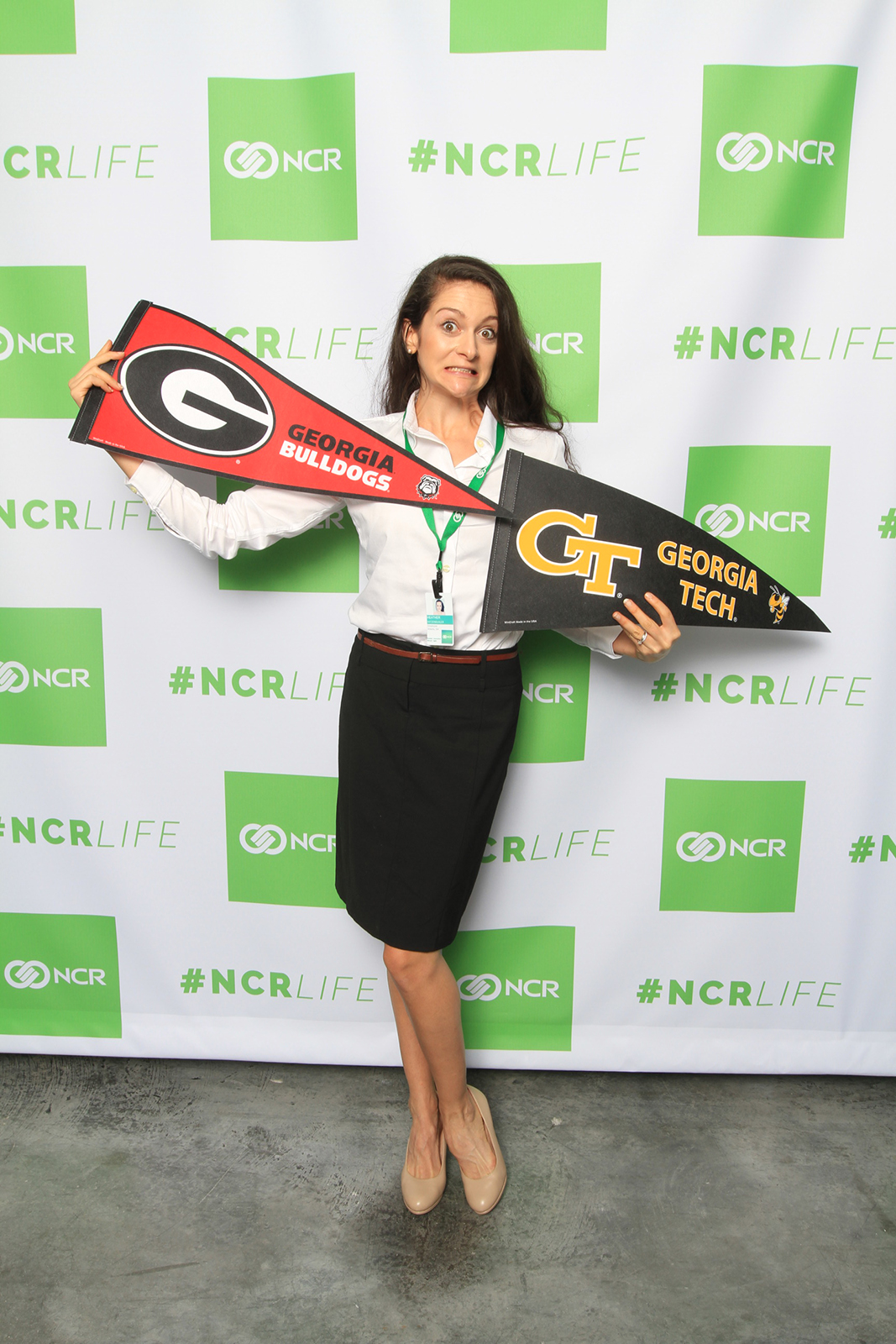 heather arentson with uga and georgia tech school penants