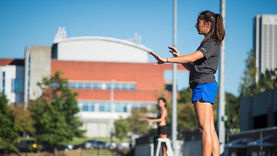 Drum major Dawn Andrews directs the Georgia Tech MArching Band at a practce rehearsal. 