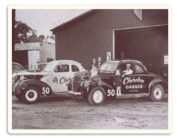 Vintage photo of stock cars outside the Cherokee Garage