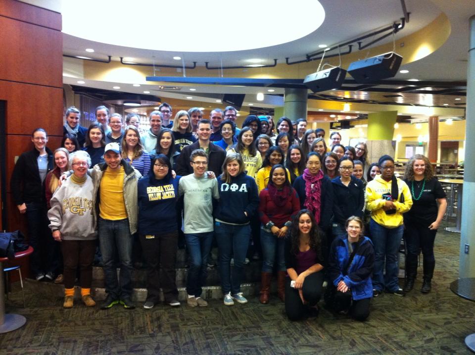 Students and staff, both male and female, participate in the 2013 Women's Day of Service.