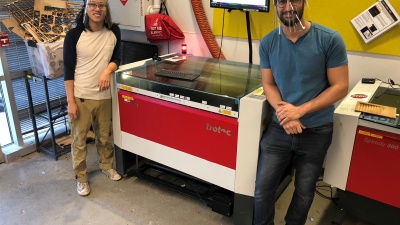 To help meet the need for personal protective equipment (PPE) for health care workers, Georgia Tech has designed and is producing face shields. Shown is a laser cutting machine used to create frames for the shields.