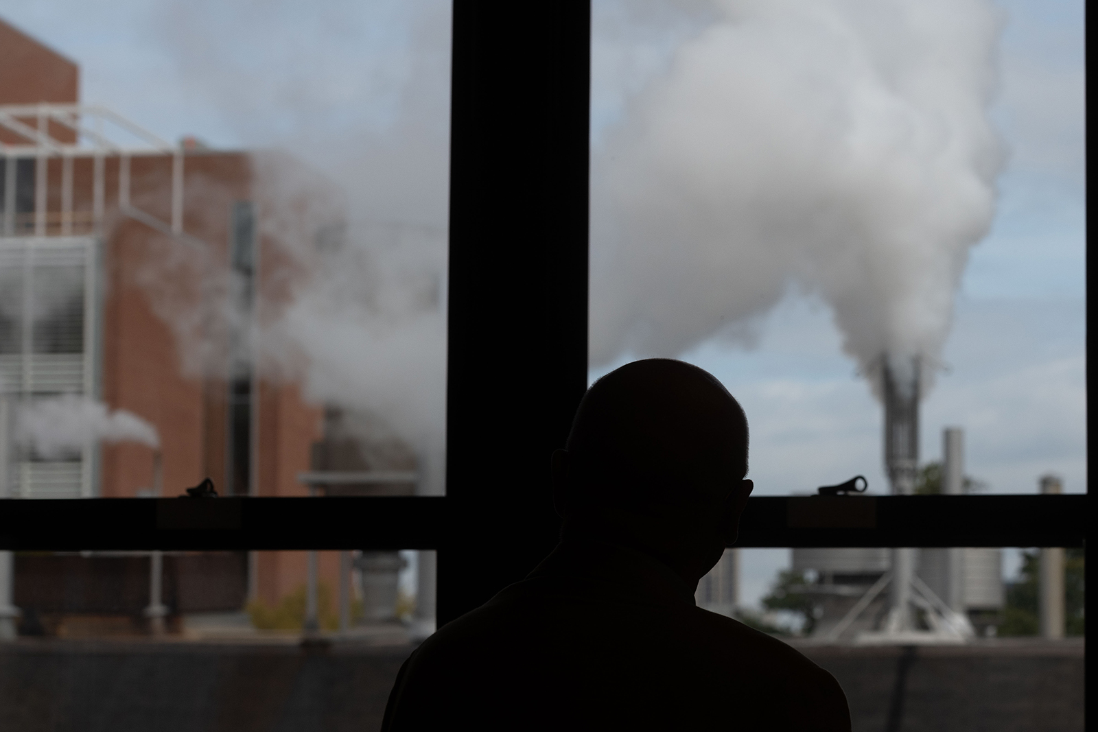 Colin Potts looks at the steam whistle from his office window