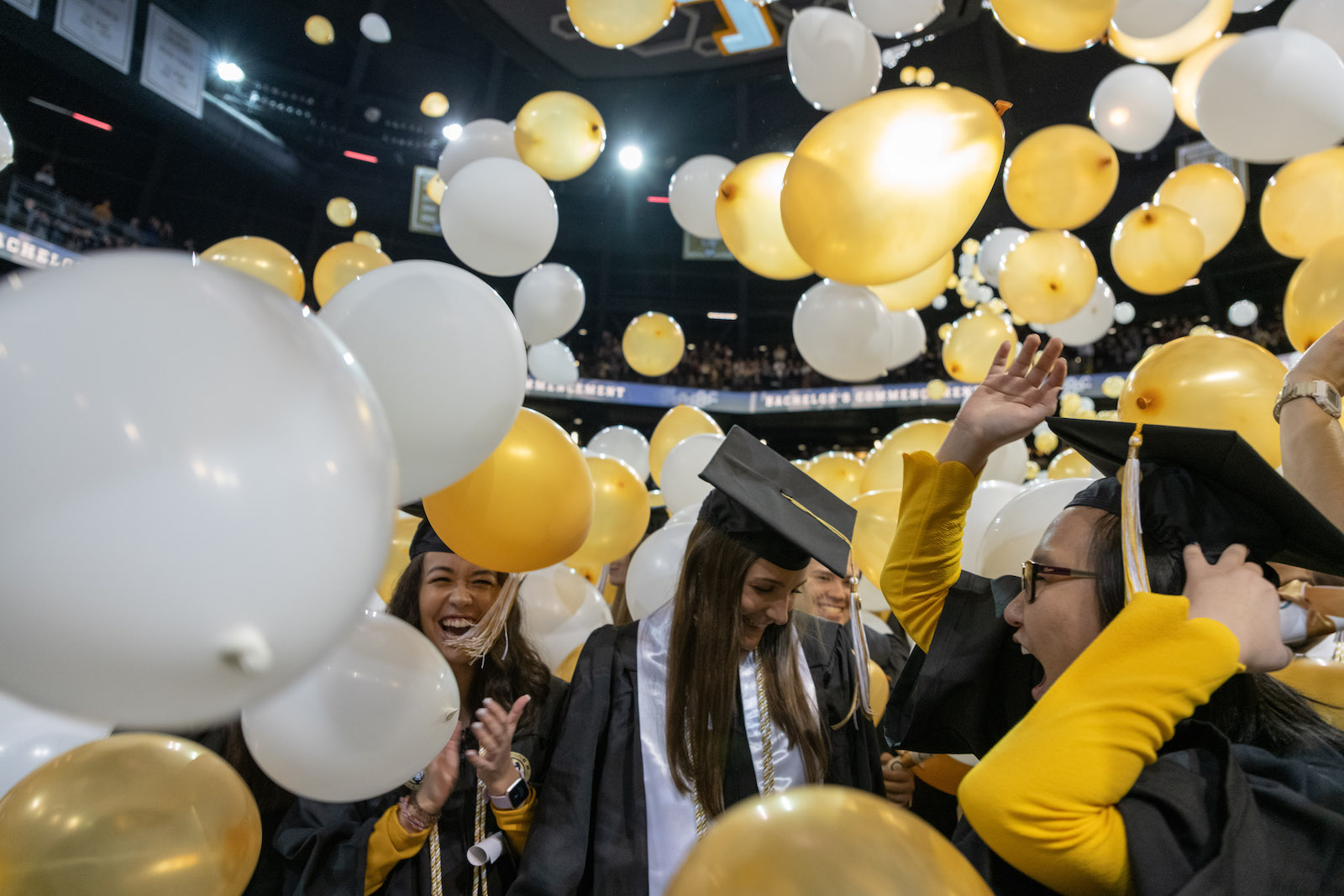 Graduates with balloons at Fall Commencement 2019