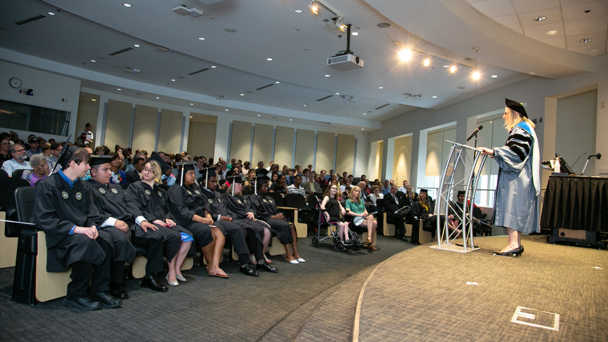 terry blum speaks at the excel graduation