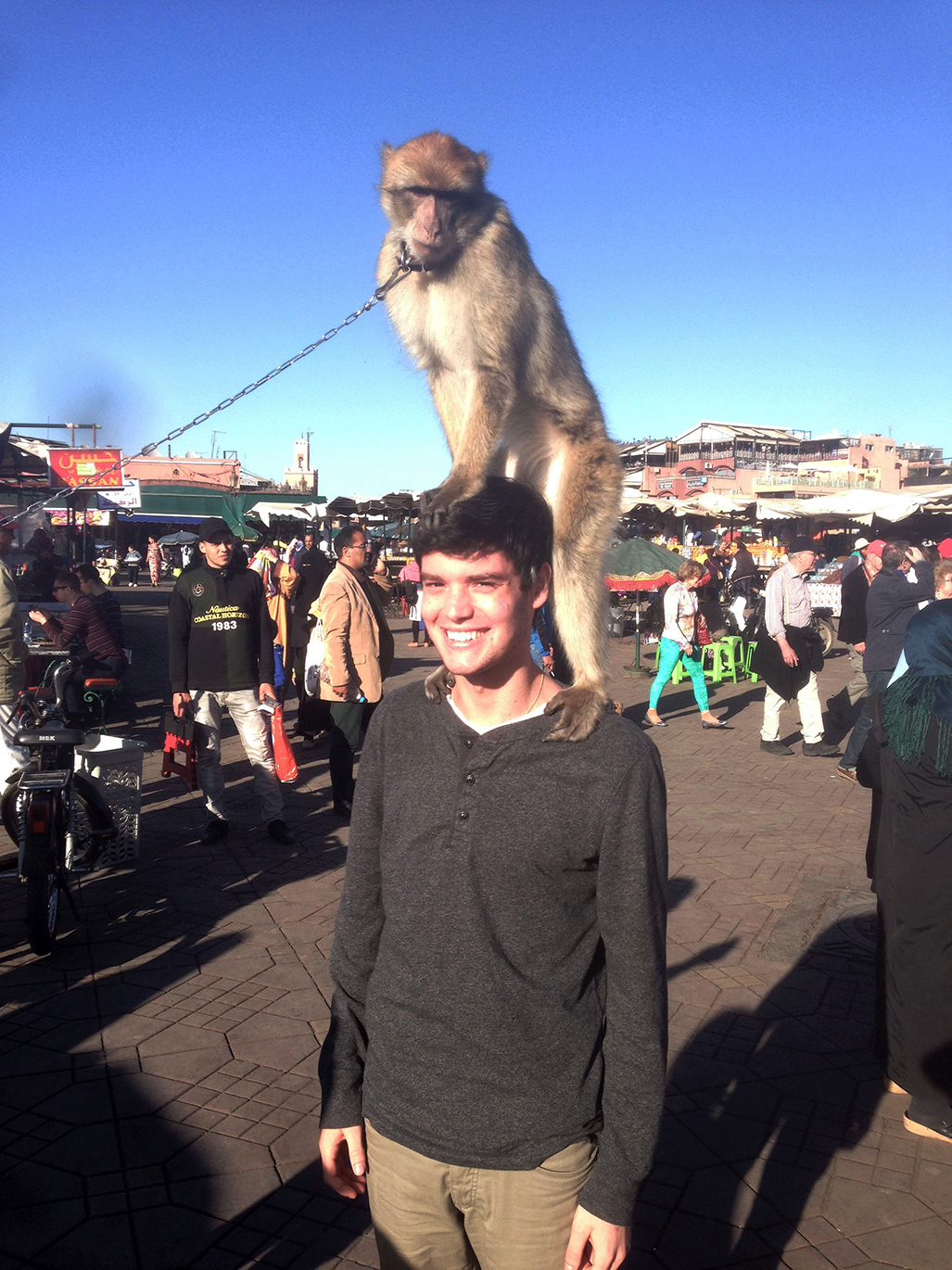 Daniel with a monkey in the central market in Marrakech, Morocco, 2015