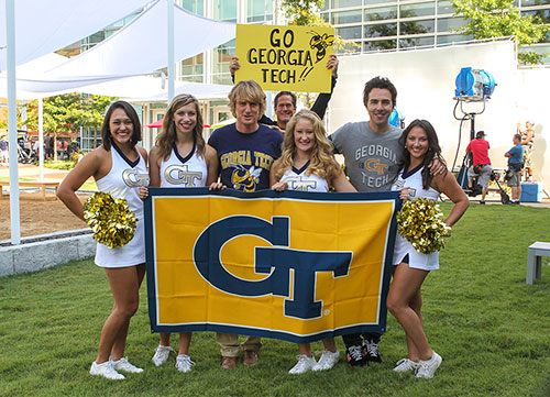 Owen Wilson poses with Georgia Tech cheerleaders during the filming of The Internship.