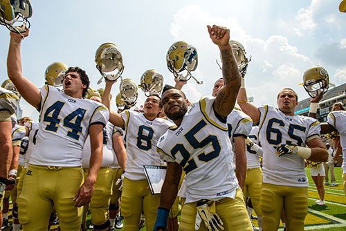 Members of the Georgia Tech football team celebrate their victory.