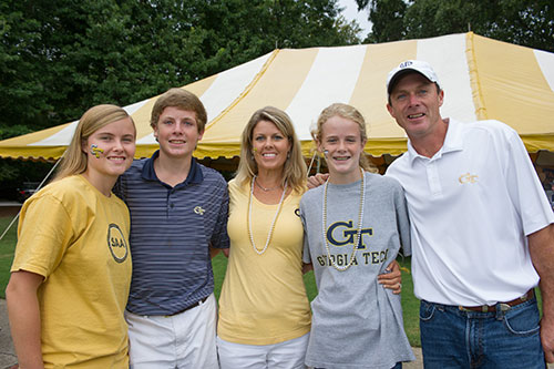 Participants in Family Weekend smile for the camera.