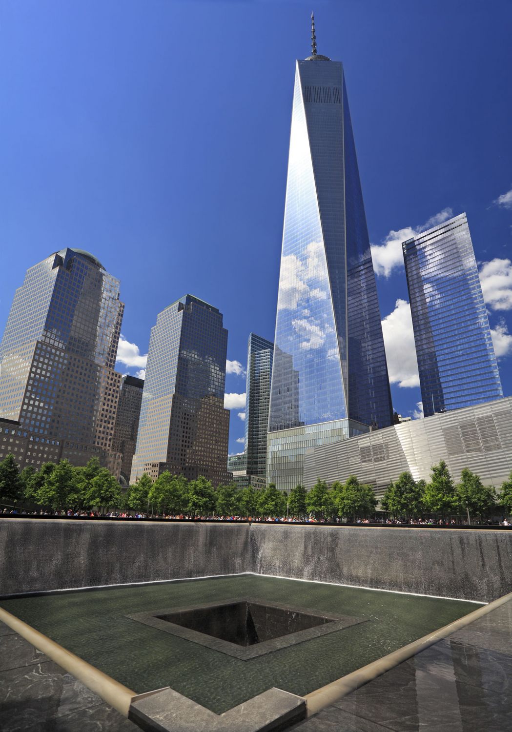The 9/11 Memorial Plaza, showing one of the fountains with skyscrapers in the background