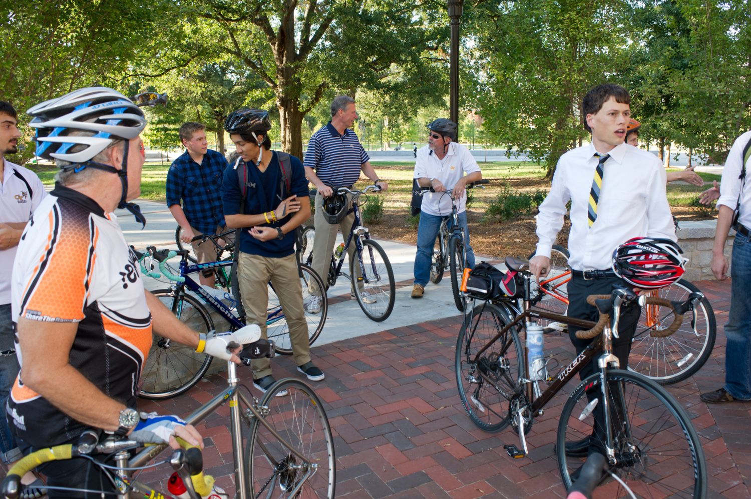 President Peterson talks with attendees at a Ride with the President during Bike Week