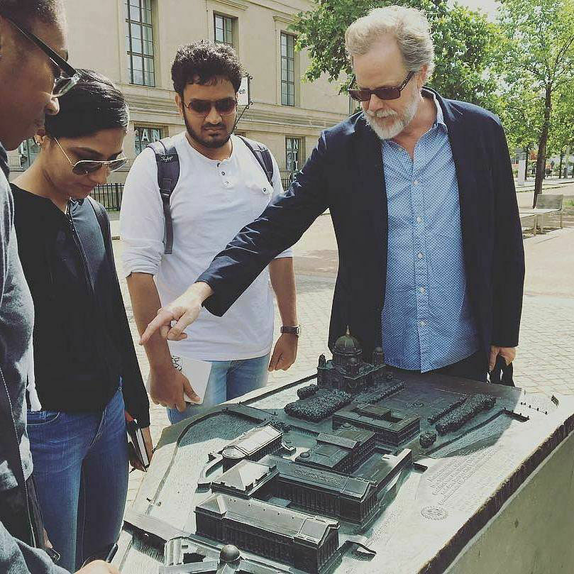 Snapshot of Michael Gamble with students outdoors in Europe