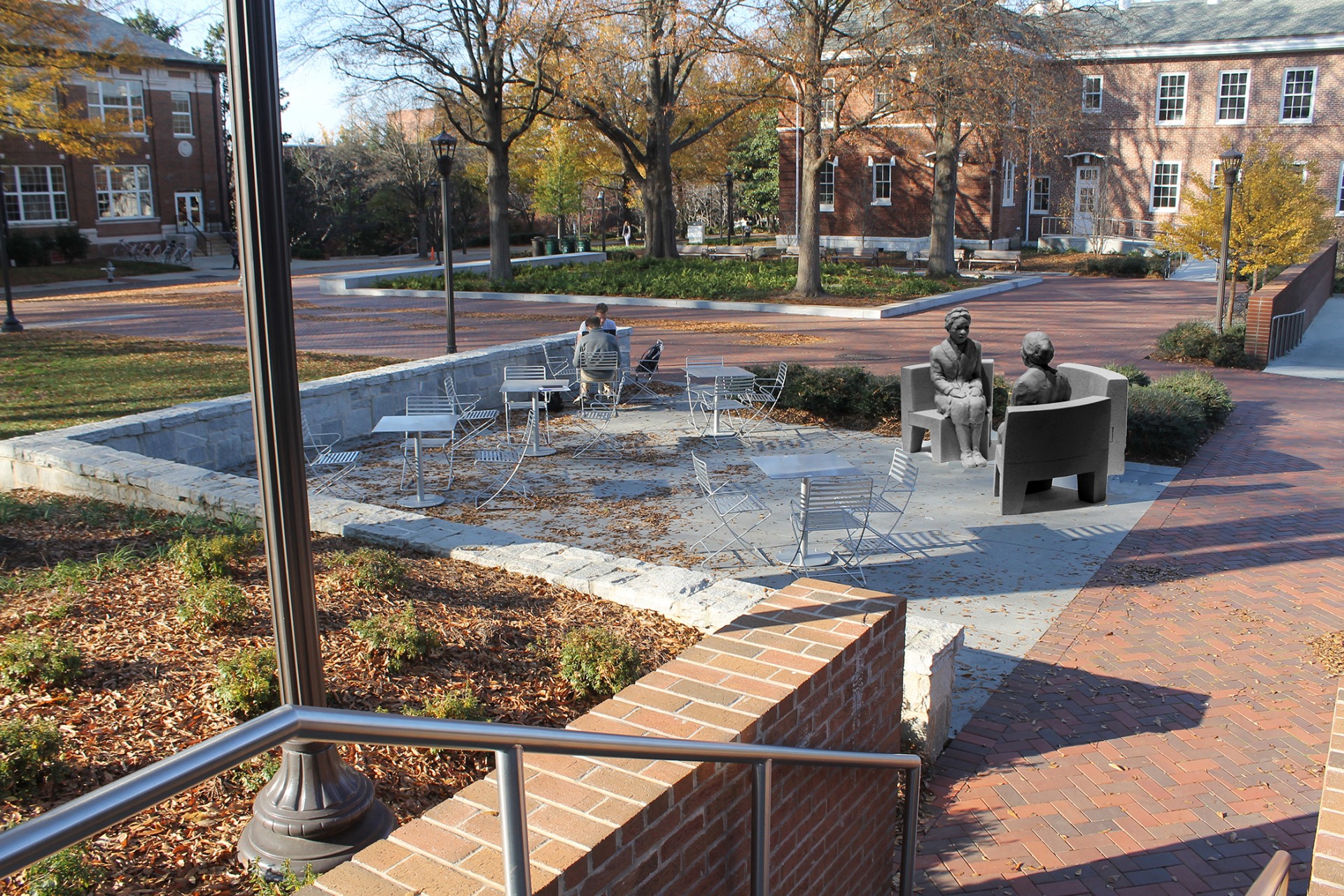 Mockup of sculpture with two Rosa Parks sitting with a bench between them in Harrison Square