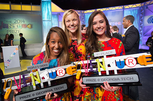 The winning team from 2014 poses with their Inventure prize trophies