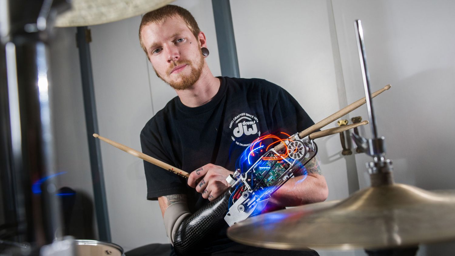 Drummer with robotic drumming arm