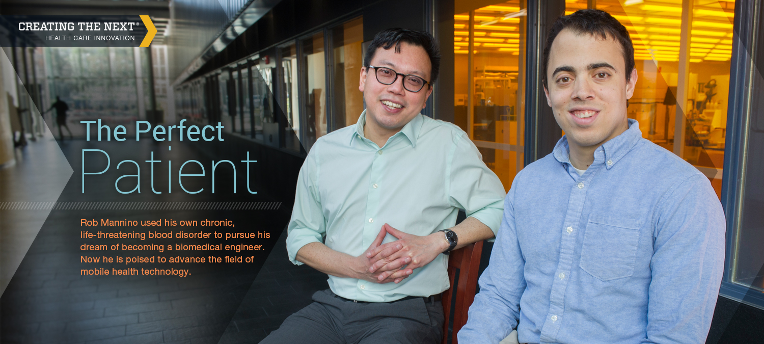 Dr. Wilbur Lam and his mentee Rob Mannino sitting in front of a laboratory to discuss Rob's research