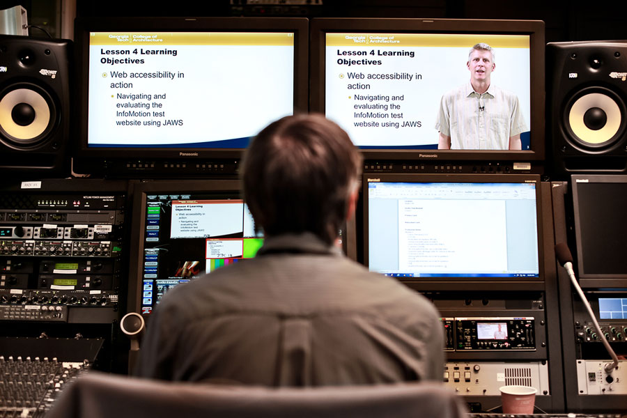 A film editor in the GTPE studio working on an online class