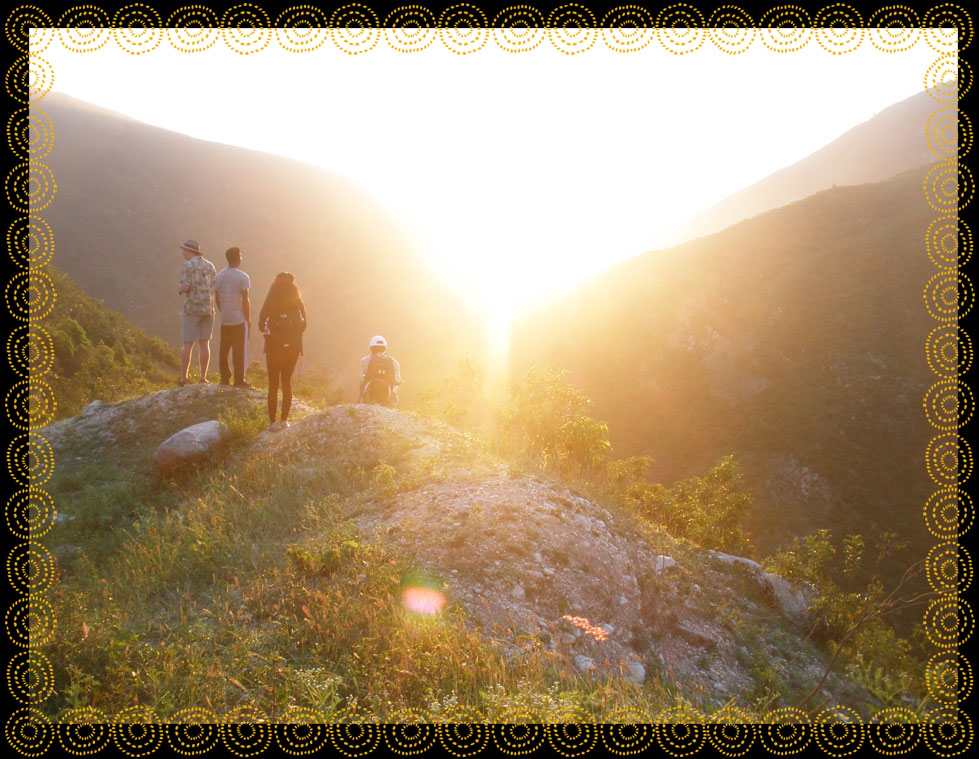 Students watch a sunset together