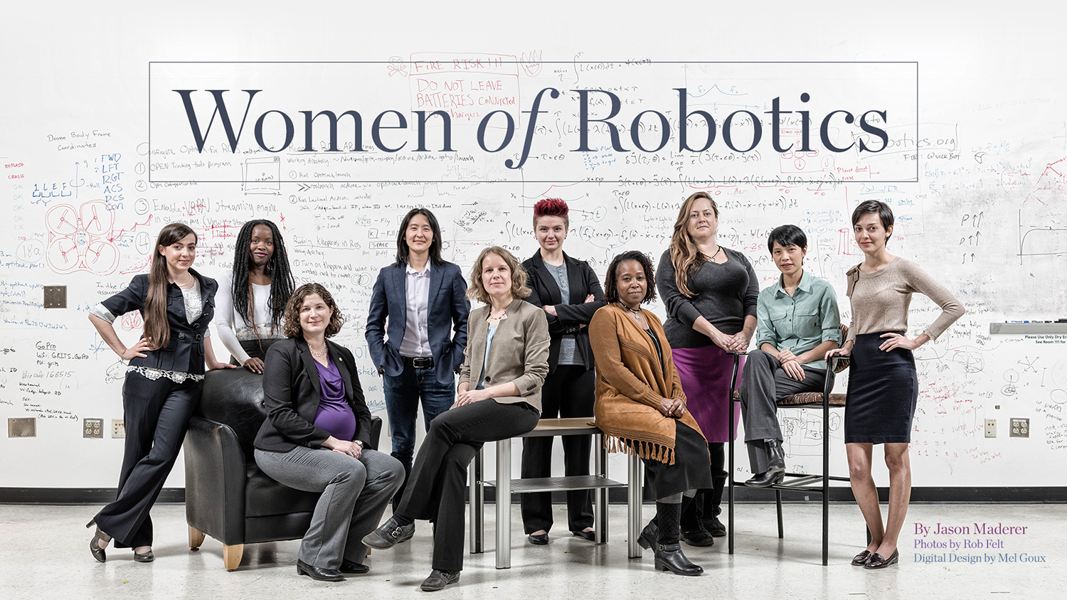 photo - group of 10 women in front of large white board in robotics lab