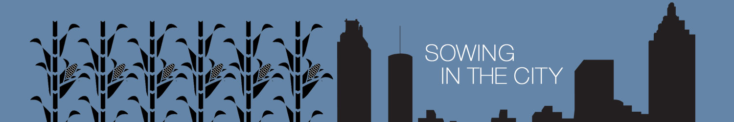 Graphic illustration of corn stalks growing next to the Atlanta city skyline.