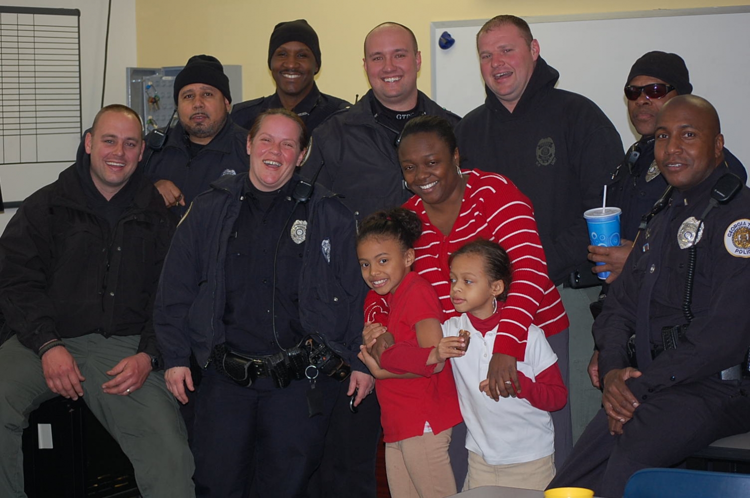 Georgia Tech police pose with Botts family