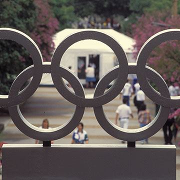 photo - looking through olympic rings sculpture to Georgia Tech campus