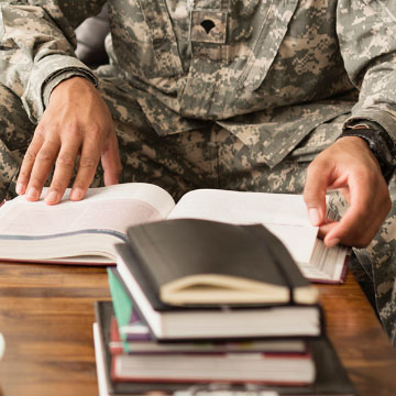 A soldier studying for his professional education certificate