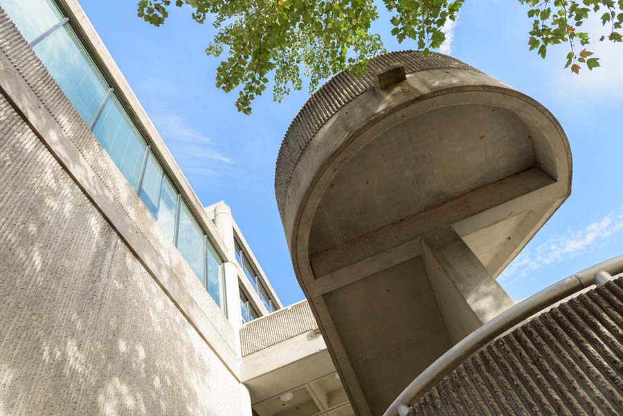 The sculptural concrete “brutalist” exterior staircase of the West Architecture Building [College of Design, constructed in 1980] was inspired by the pioneering modern architect Le Corbusier.