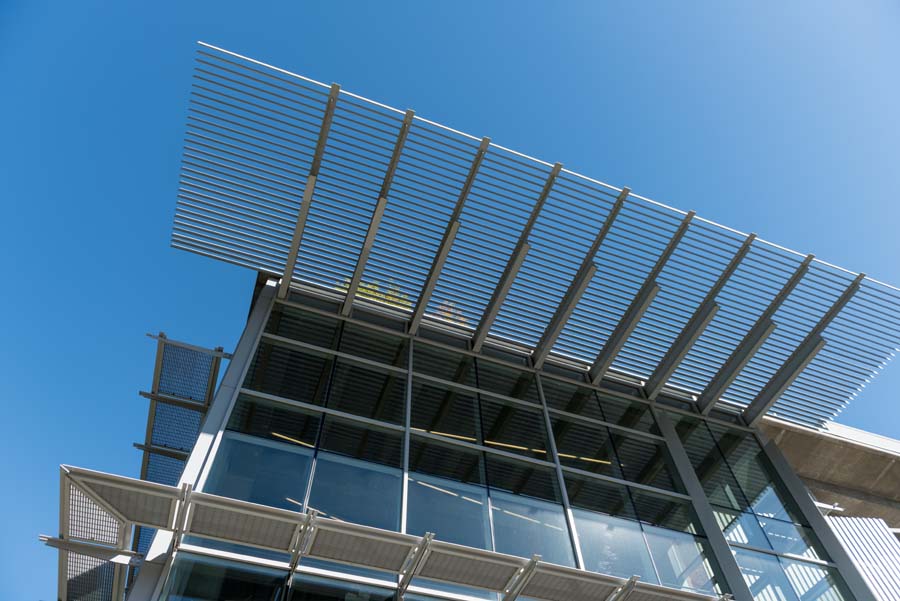 The metal screen above the entrance to Clough Undergraduate Learning Commons is one of several design features contributing to the lower energy consumption of this green building.