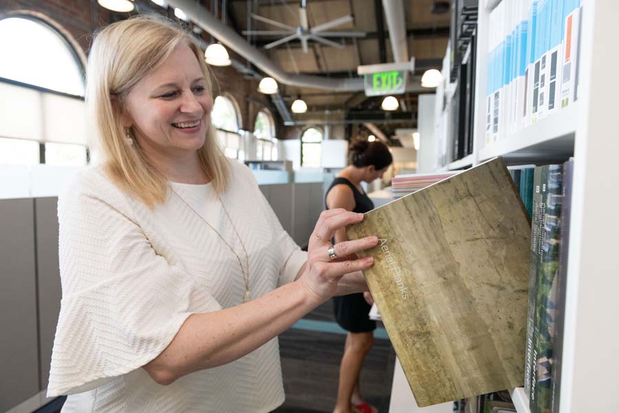 Reagan Donley checks the Interiors Library to find just the right product for a project.