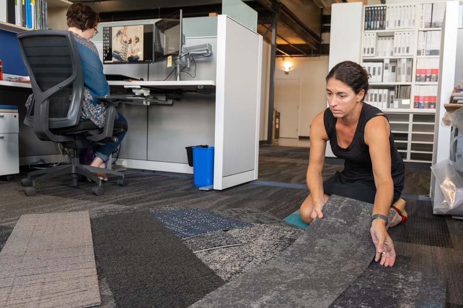 Polly Patton organizes carpet samples to present to the School of Electrical and Computer Engineering. Sometimes palette selection takes over the work space.