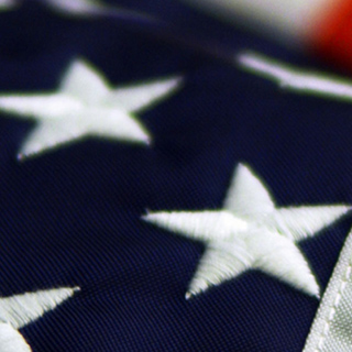 A close up shot of stars on the American flag.