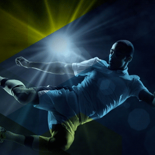 A soccer player kicking a ball.