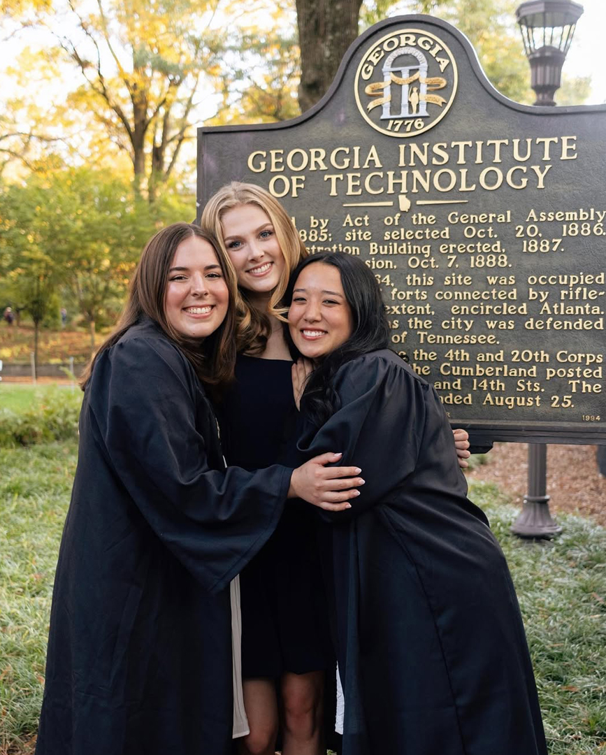 graduates at historical marker