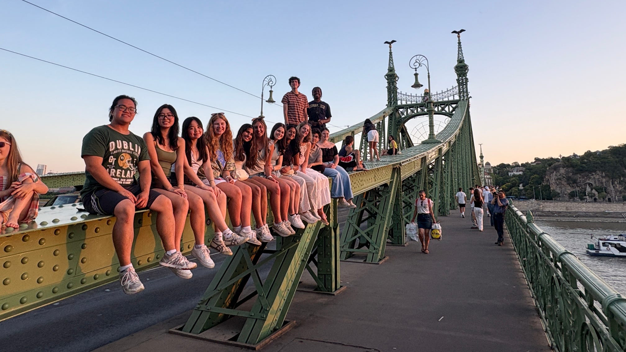 students on bridge in budapest