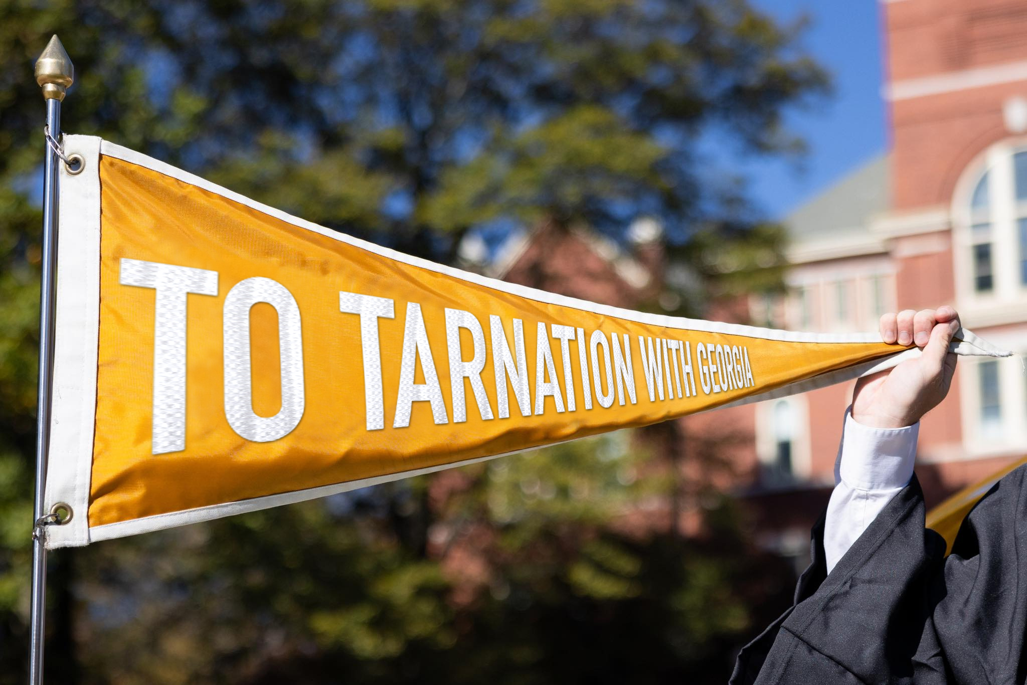 Flag of the Ramblin' Wreck, but now says "To Tarnation with Georgia"