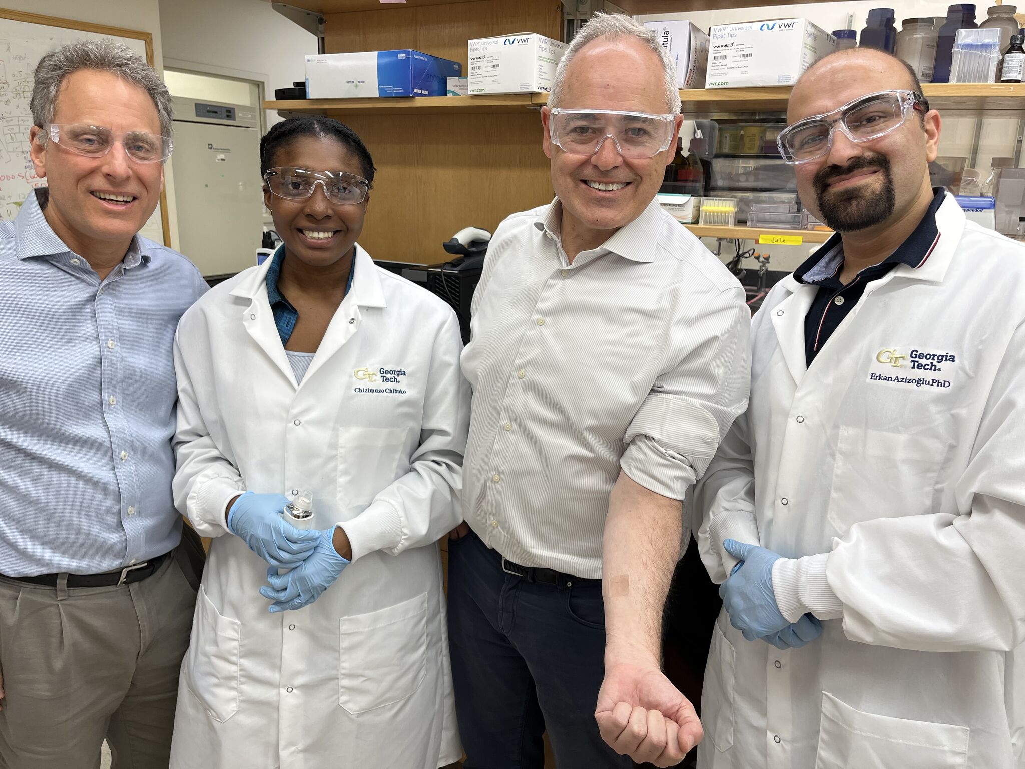 President Ángel Cabrera visits the lab with Mark Prausnitz to see needle‑free and microneedle drug‑delivery technologies being developed for real‑world medical use. 