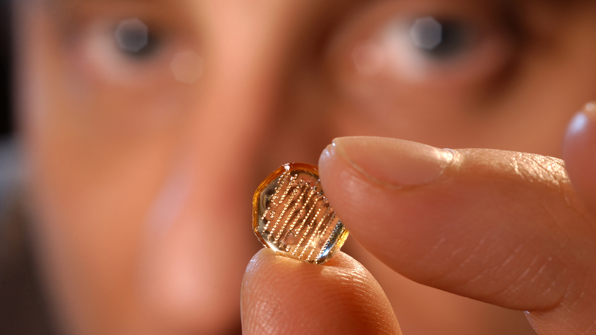 prausnitz holding a microneedle array
