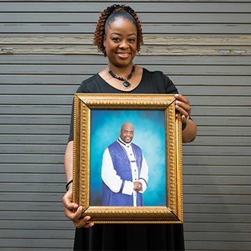 Quinae Ford with photo of her father 
