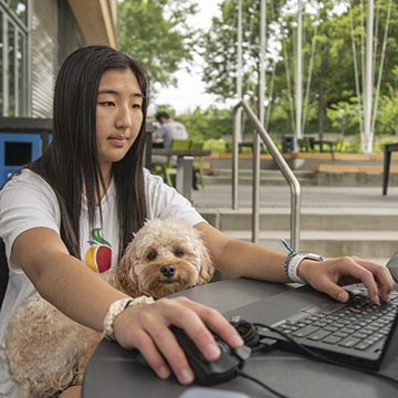 a student and her dog