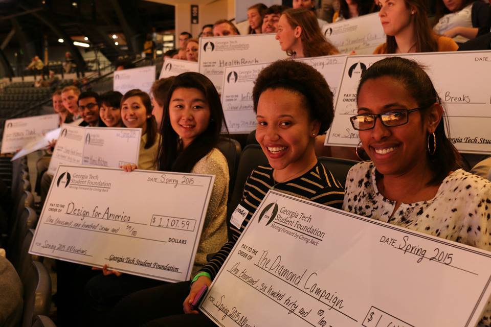 Students accept their checks from 2015 Georgia Tech Student Foundation allocations at a special event at McCamish Pavilion.
