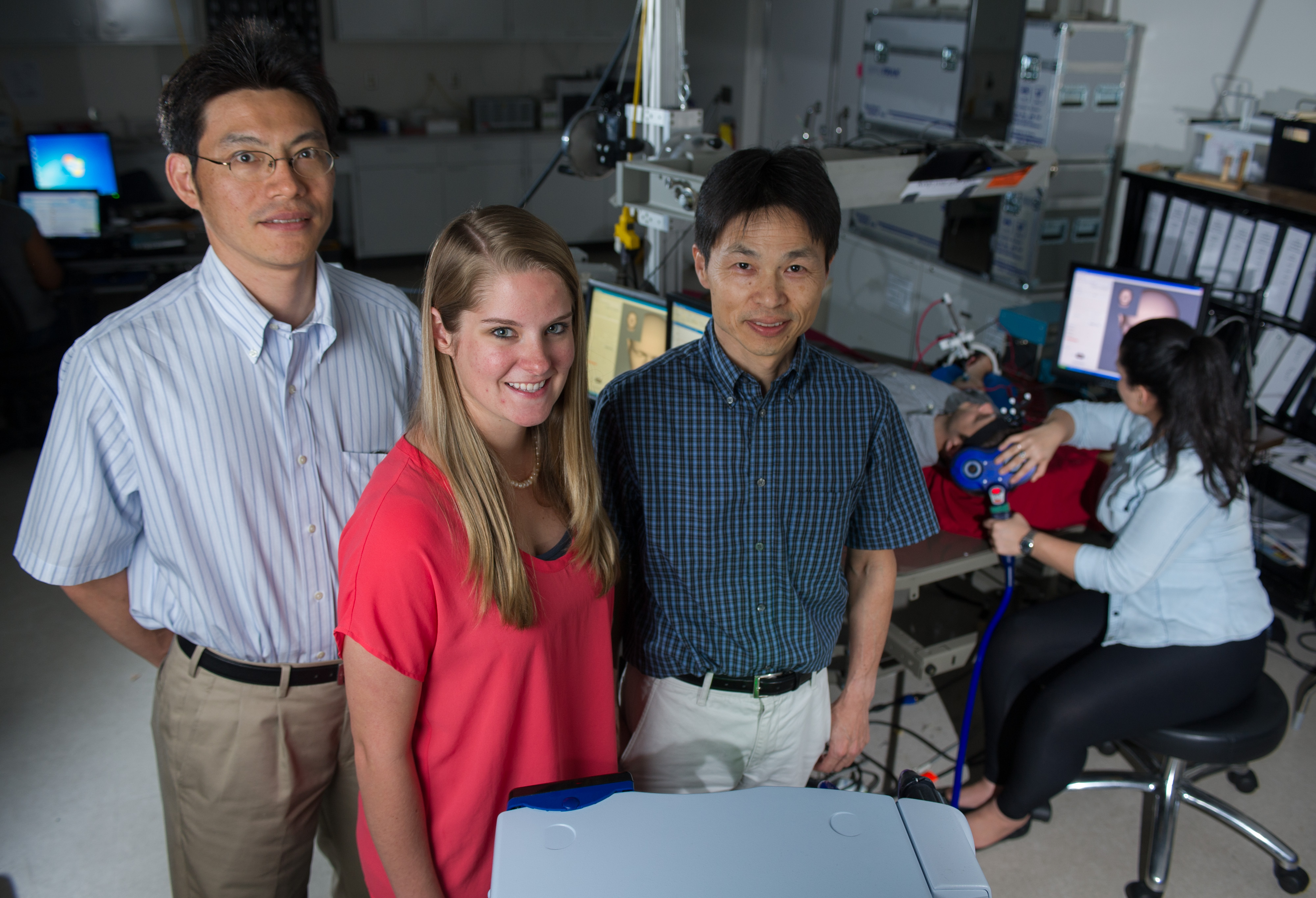 Georgia Tech has created functional MRI-compatible rehab device for stroke patients than creates a long latency stretch reflex at the exact time as a brain signal. Pictured left to right: Jun Ueda (associate professor in the George Woodruff School of Mechanical Engineering), Lauren Lacey (Georgia Tech master's graduate student in ME) and Minoru Shinohara (associate professor in the College of Science's Human Neuromuscular Physiology Lab).  