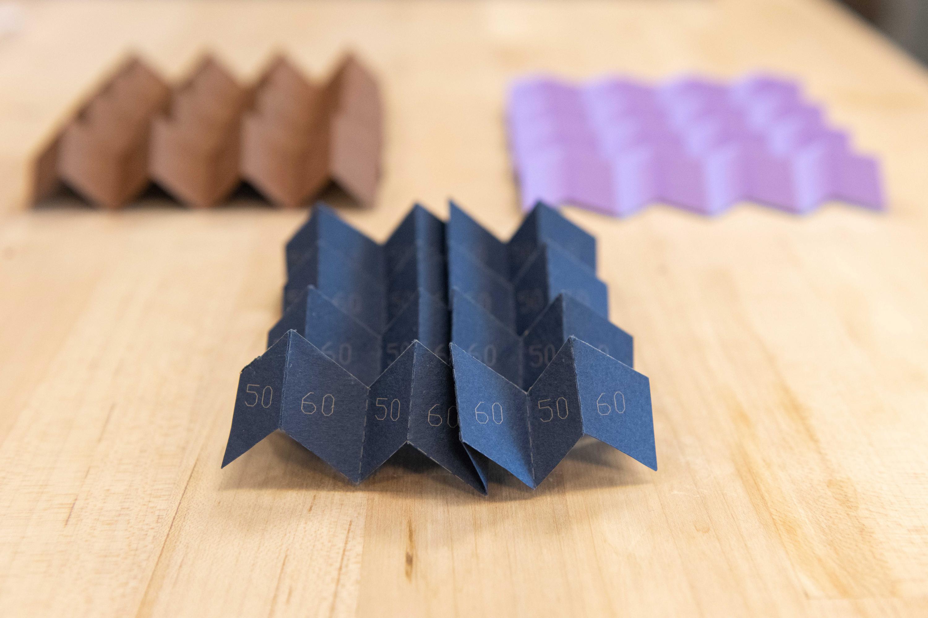 A new type of origami can morph from one pattern into a different one, or even a hybrid of two patterns, instantly altering many of its structural characteristics. (Credit: Allison Carter)