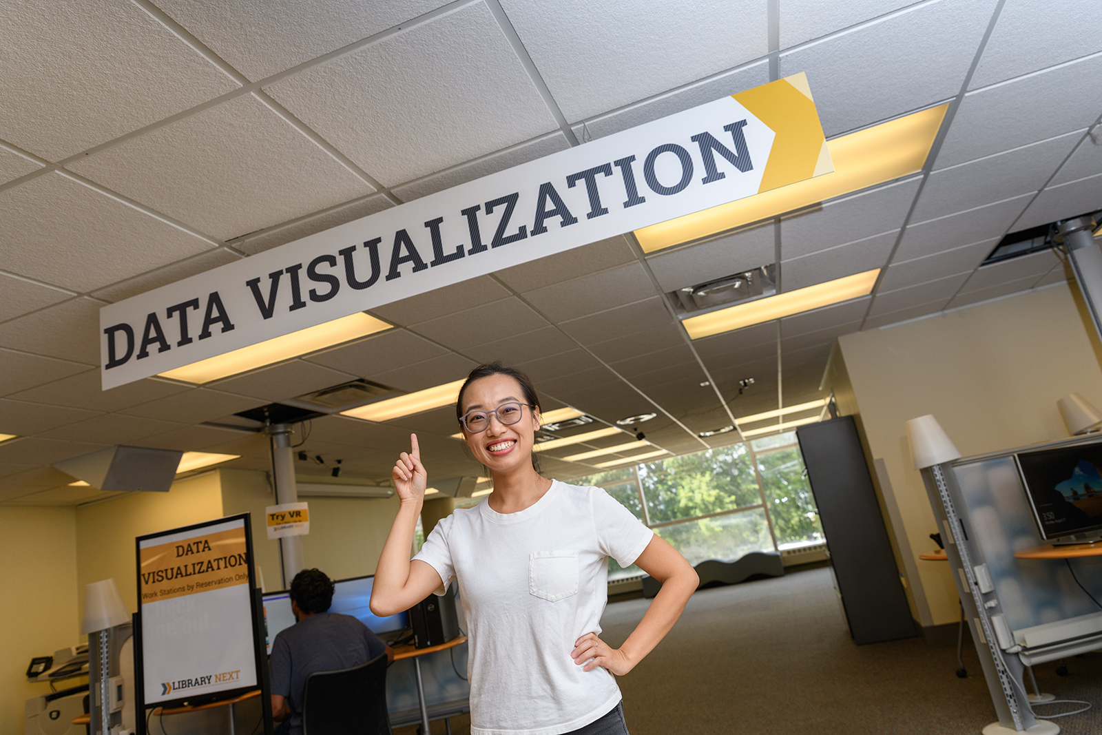 Ximin Mi in the data visualization area of the Georgia Tech Library