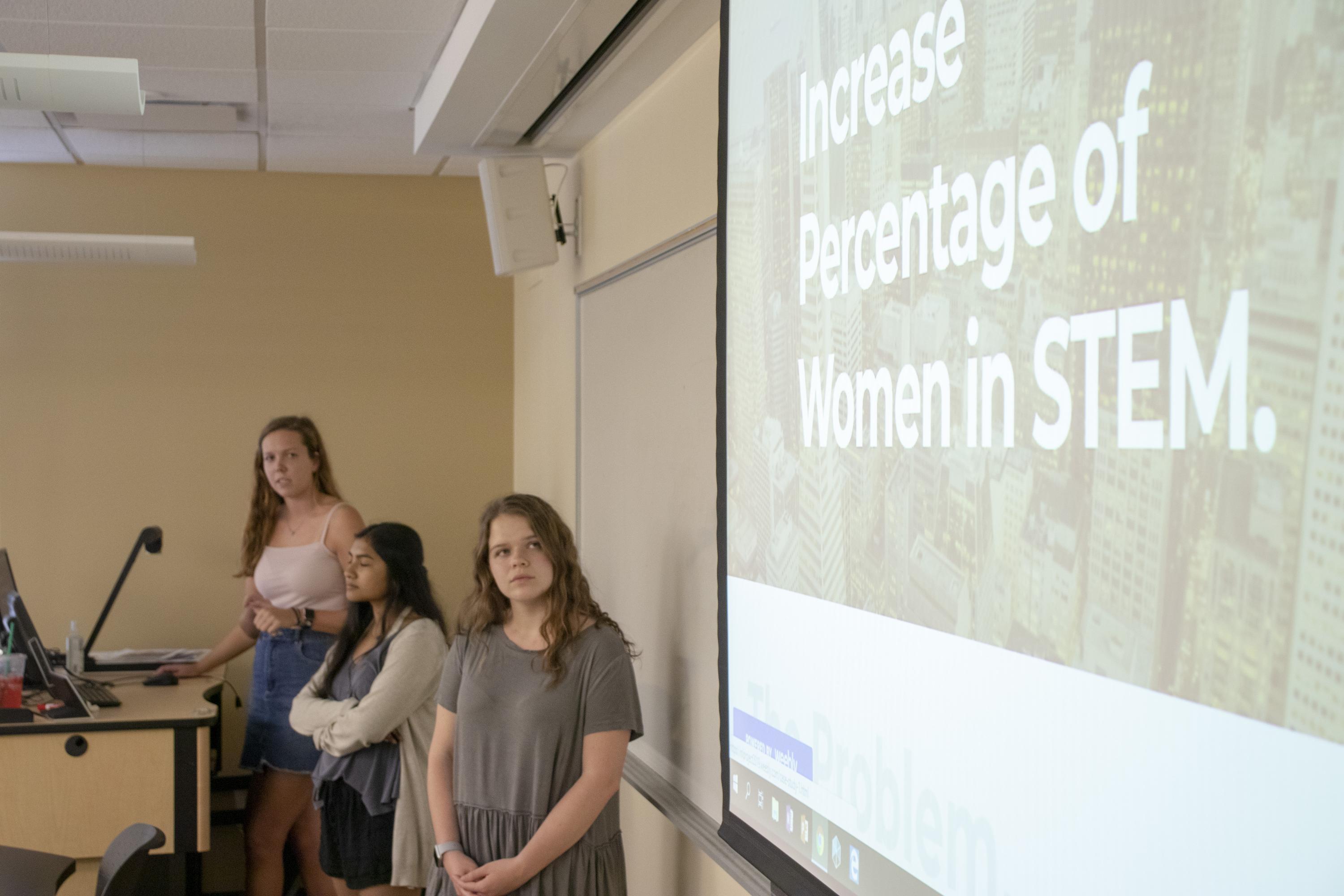 From left, first-year students Caitlyn Beals, Sabirah Haque, and Juliet Orth, present their Humanities in the Field project as part of the Career Design for Global Citizenship class on April 17, 2019. For their project, the students, who are residents of the Global Leadership Living Learning Community, researched companies that work to create increased access to education for underrepresented and disadvantaged communities, in Atlanta and nationally.