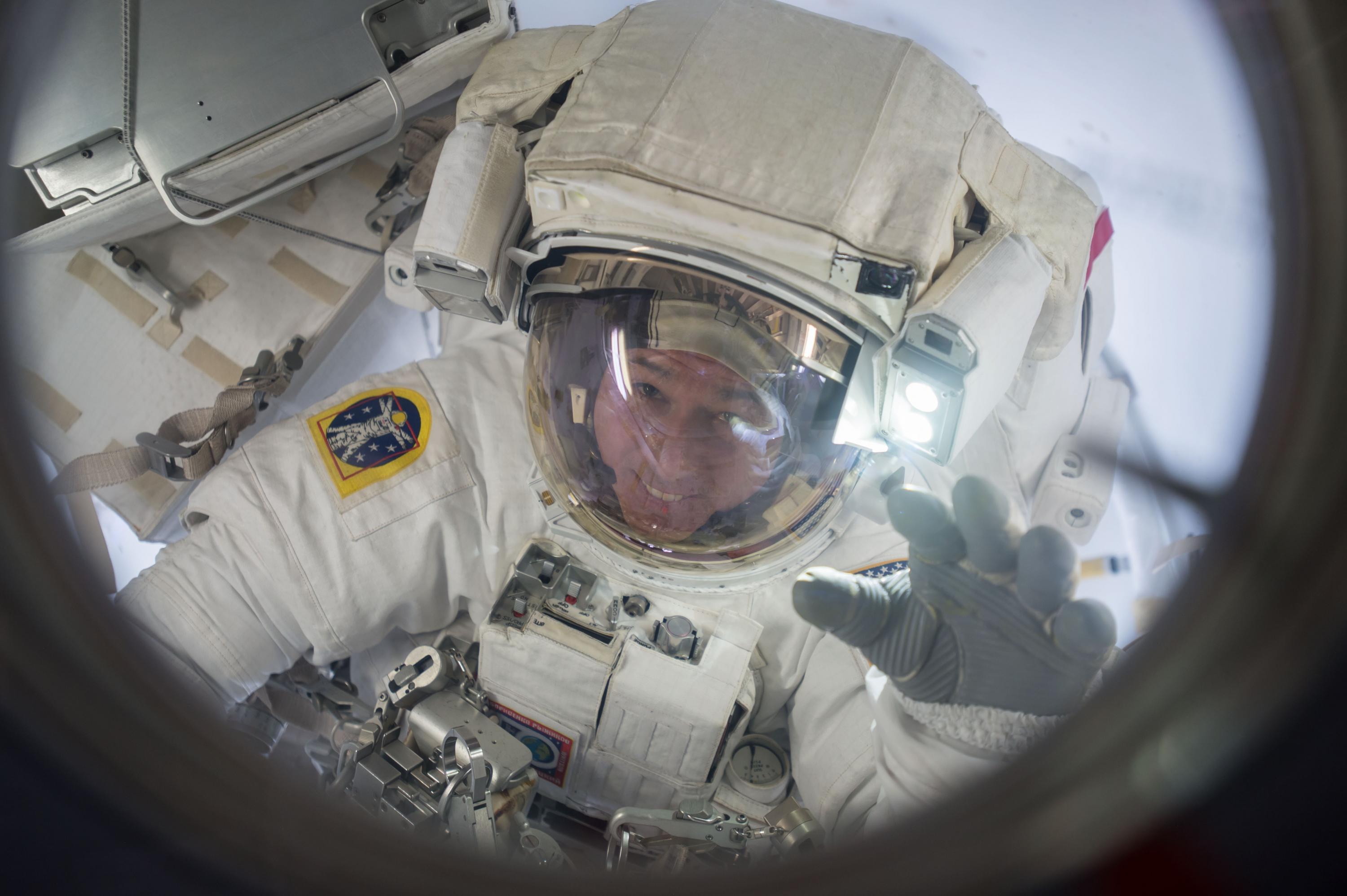 Tech graduate Shane Kimbrough is seen floating in the Quest airlock at the end of a spacewalk outside the International Space Station. Photo courtesy: NASA on March 24, 2017