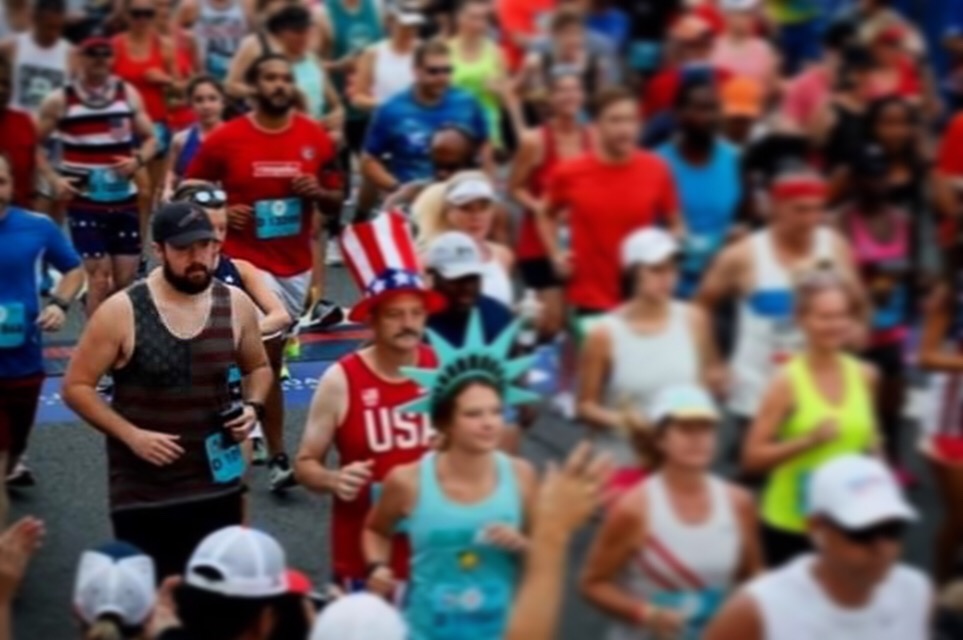 Pierce (Pictured left in the American flag tank top) ran the Peachtree Road Race after spending weeks learning how to walk again.