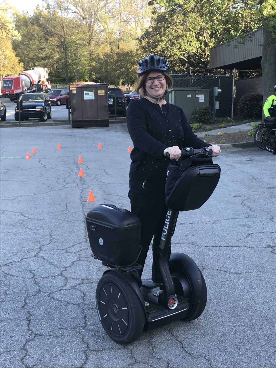 Brenda Morris, a graduate of the Citizen's Police Academy, learns to ride a Segway as part of the training.