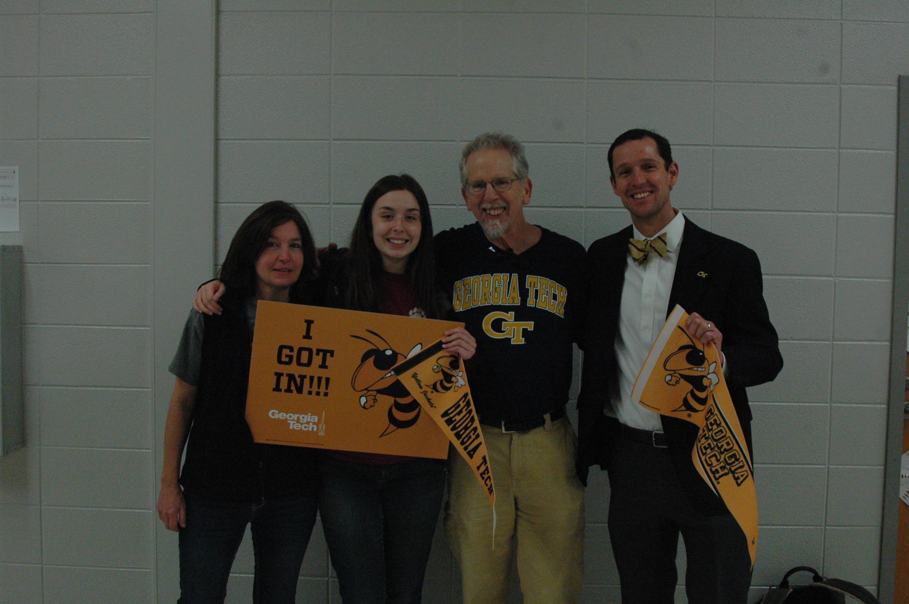 Rick Clark, director of Undergraduate Admission at Georgia Tech, poses with Ava Thrasher and her parents after the Gilmer High School senior learned she was admitted to Georgia Tech through Early Action. 