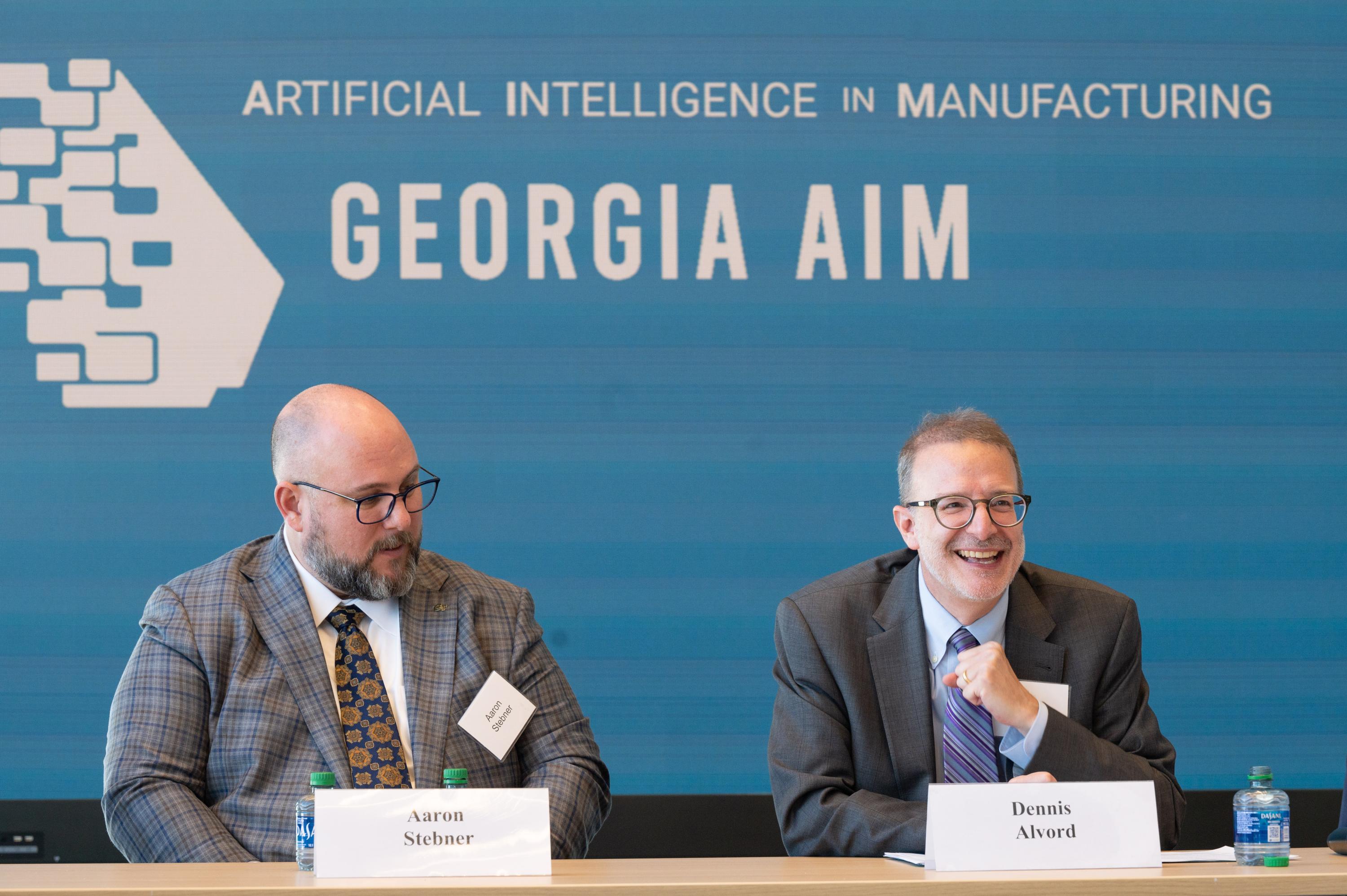 Dennis Alvord (right), the Economic Development Administration’s deputy assistant secretary for economic development and chief operating officer, reacts to comment during a roundtable discussion with members of the Georgia AIM coalition, a multi-program effort being led by Georgia Tech to bolster innovation in manufacturing and artificial intelligence. (PHOTO: Joya Chapman)