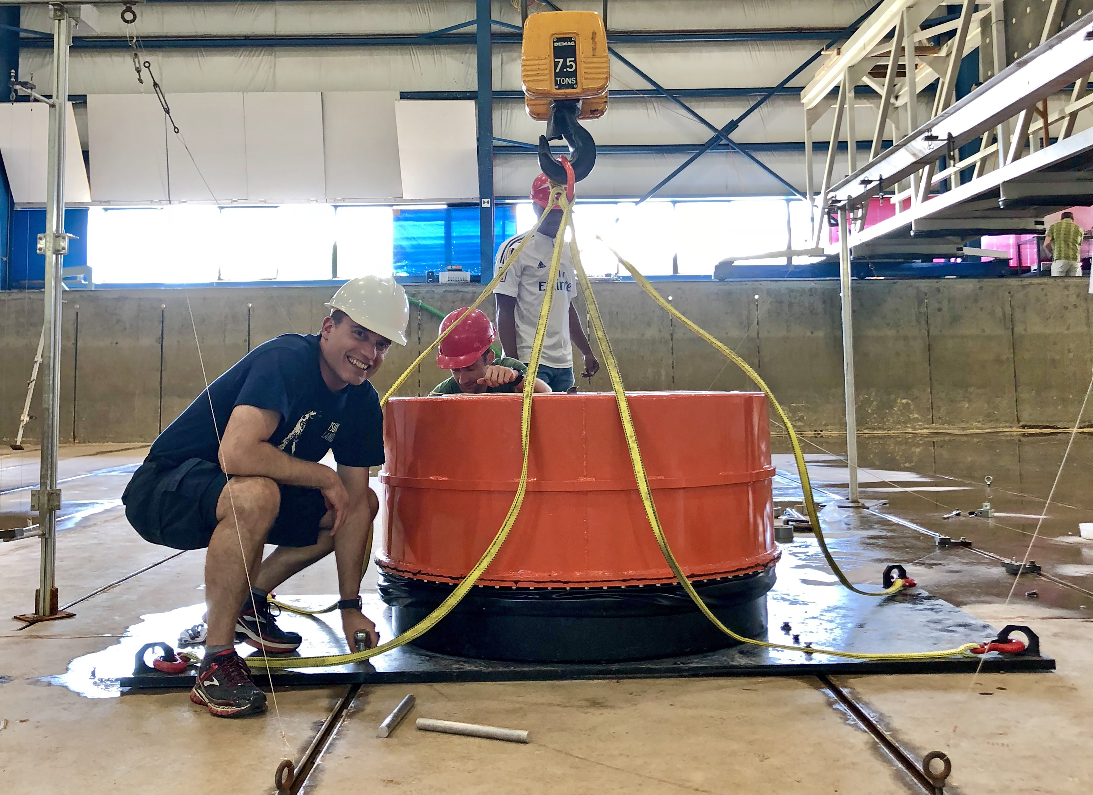 Hermann Fritz makes final preparations before the volcanic tsunami generator is installed in the wave basin at the Hinsdale Wave Research Laboratory at Oregon State.